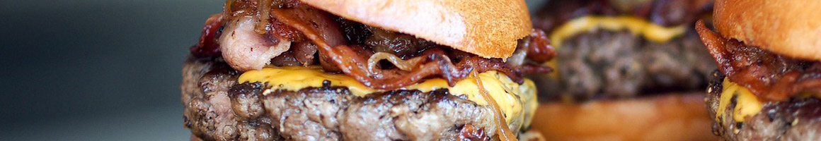 Eating Burger Food Stand at Daily Burger restaurant in New York, NY.